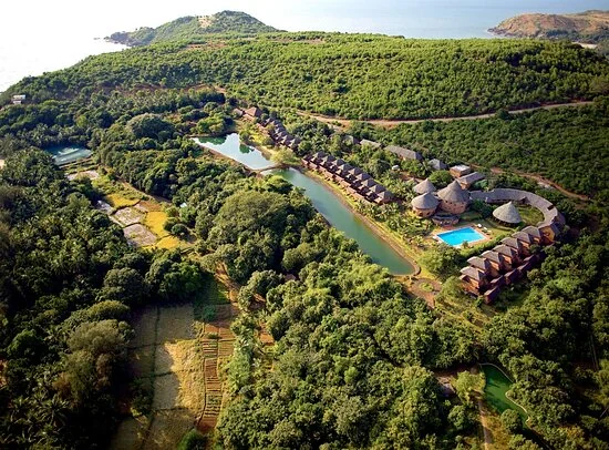 Aerial view of SwaSwara in its green coastal landscape